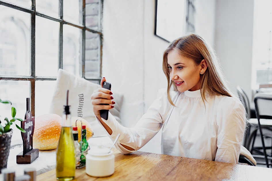 https://kaboompics.com/photo/4061/portrait-of-stylish-young-woman-sitting-at-cafe-and-taking-selfie-with-her-smart-phone